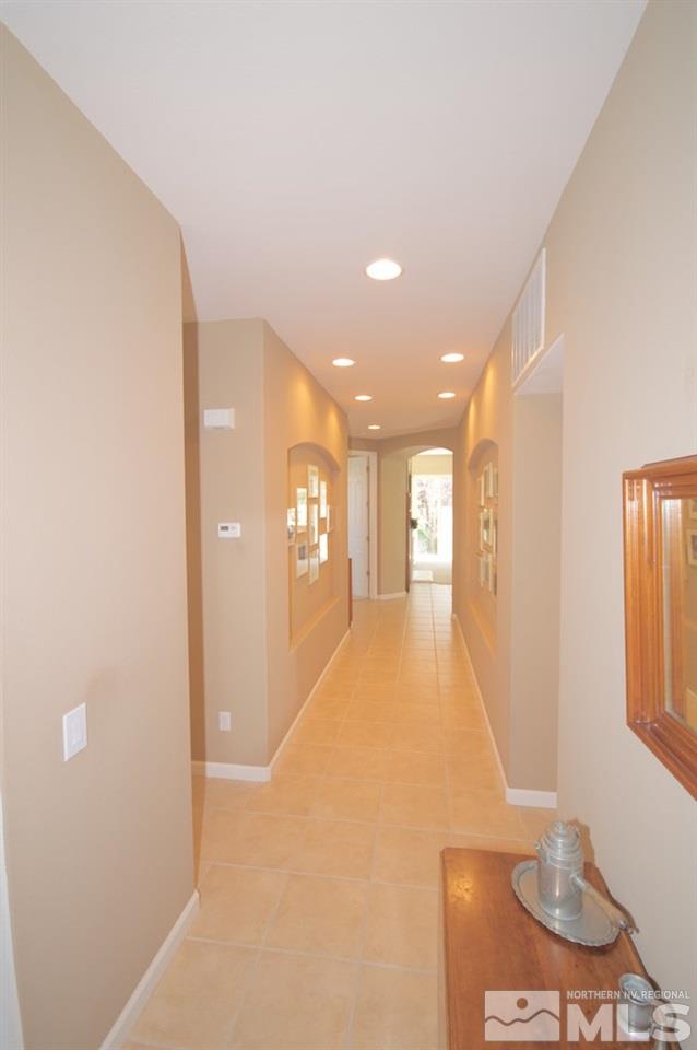 1820 Hunter Creek Road Reno, NV 89519 - Photo 9 of 22 a view of hallway with furniture and a window