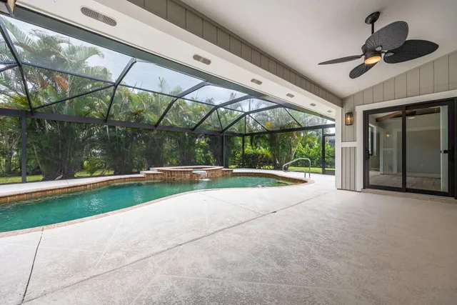 a view of swimming pool with seating space and balcony