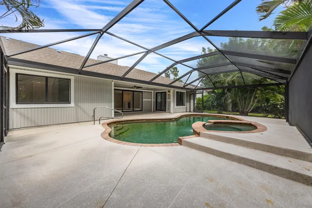 a view of swimming pool with yard