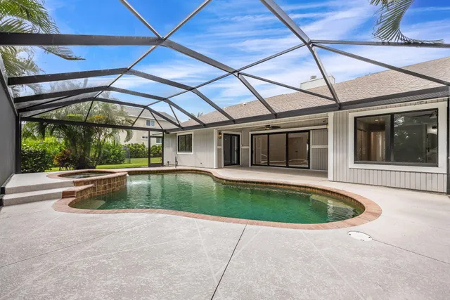 a view of a swimming pool with a patio