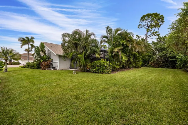 an aerial view of a house with a swimming pool