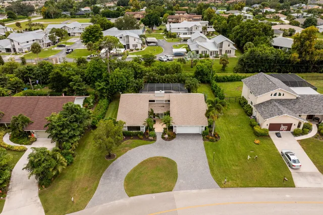 an aerial view of a house having swimming pool