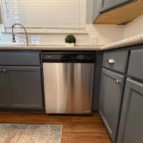 a view of a sink and a window