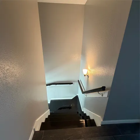 a view of staircase with wooden floor