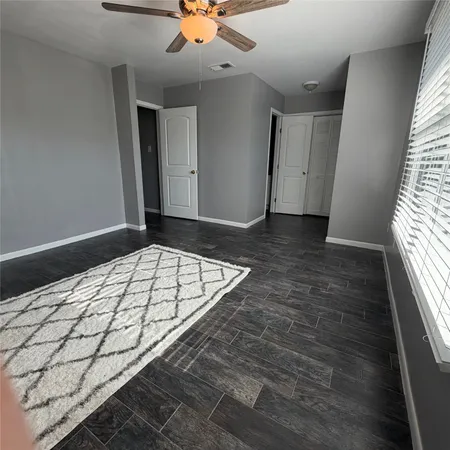 a view of a hallway to a bedroom