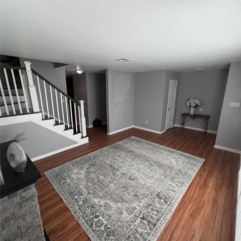 wooden floor with staircase