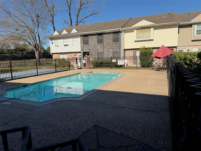 a view of a backyard with a patio