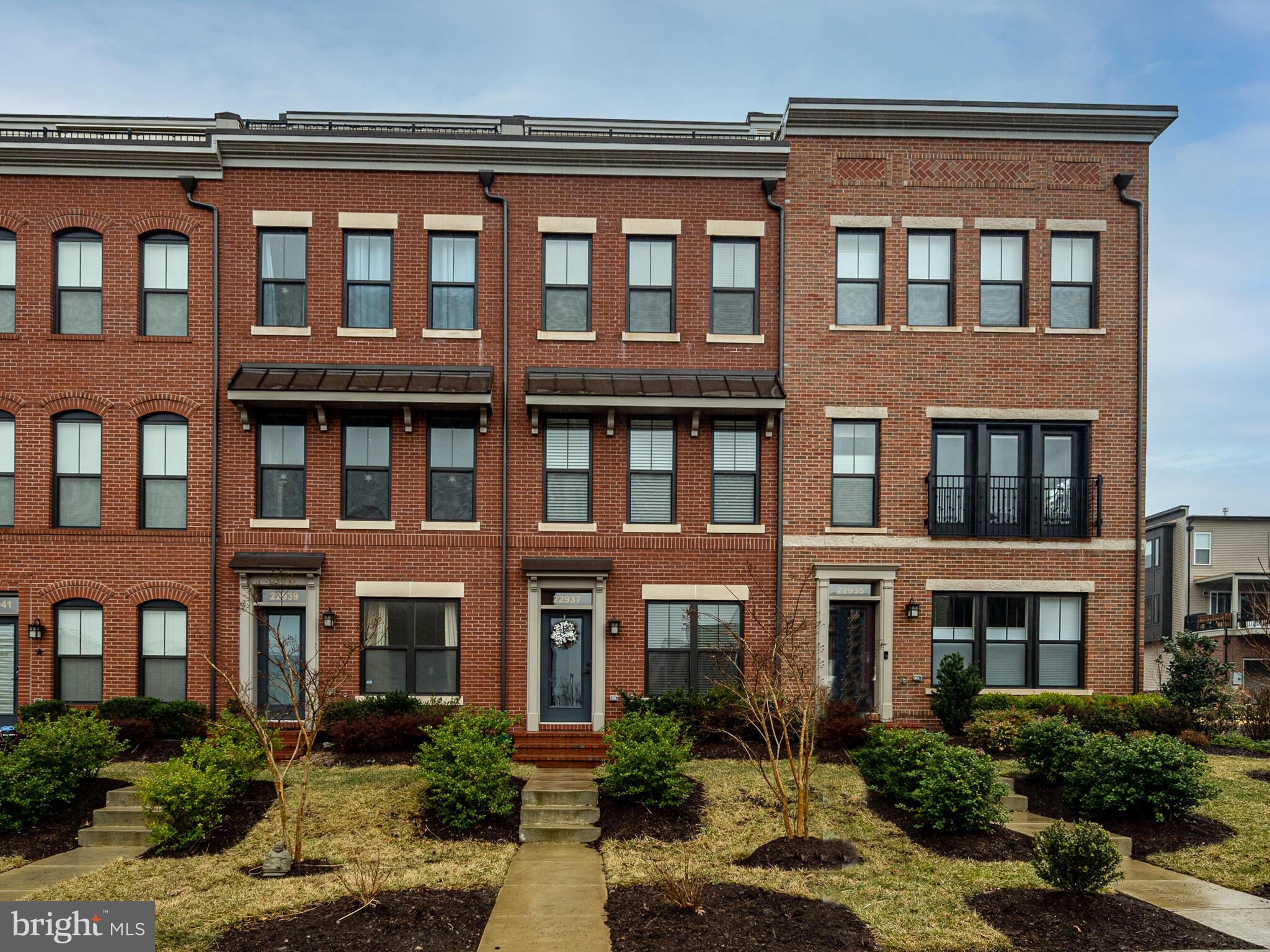22937 Sullivans Cove Square Brambleton, VA 20148 - Photo 1 of 35 a front view of a building