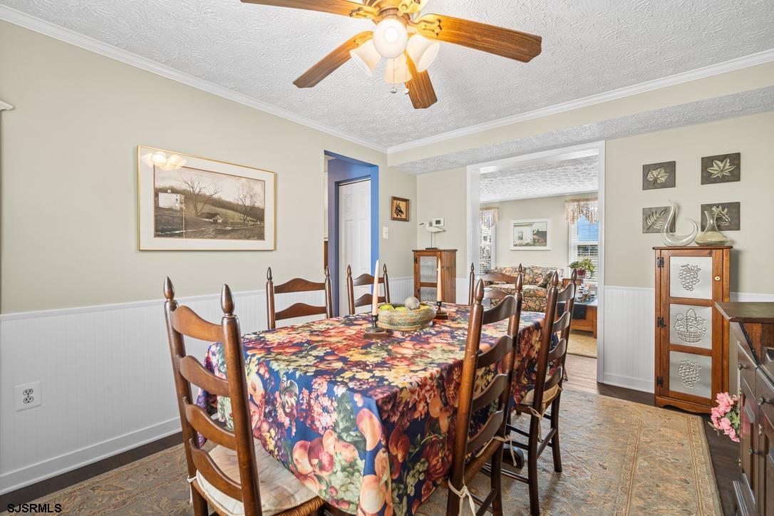 17 Manitoba Avenue Brigantine, NJ 08203 - Photo 16 of 49 a view of a dining room with furniture and chandelier