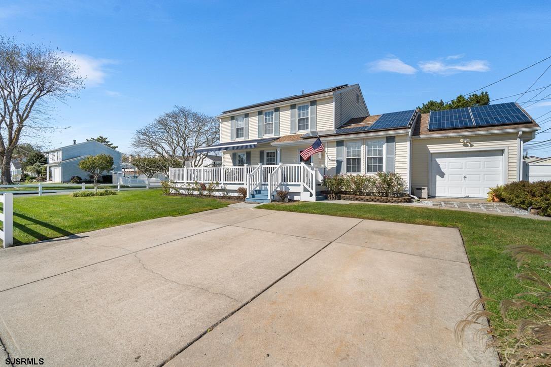 17 Manitoba Avenue Brigantine, NJ 08203 - Photo 2 of 49 a front view of house with yard and green space