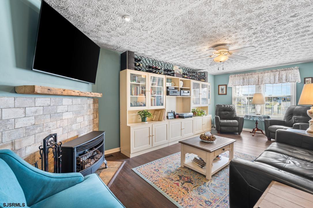 17 Manitoba Avenue Brigantine, NJ 08203 - Photo 8 of 49 a living room with furniture and a flat screen tv