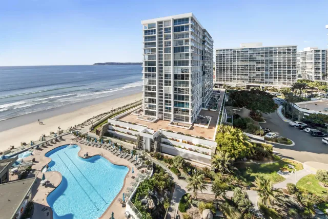 a view of a balcony with a floor to ceiling window and stairs