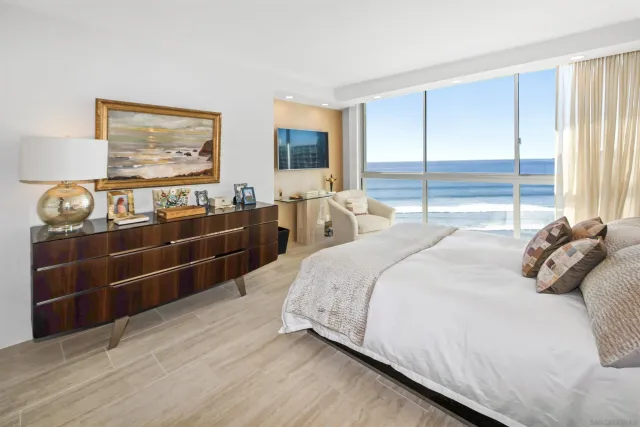 a bedroom with bed and window