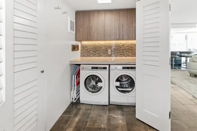 a utility room with washer and dryer