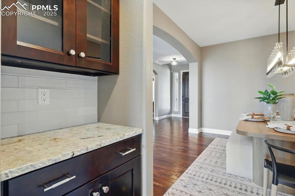 4577 Outlook Ridge Trail Colorado Springs, CO 80924 - Photo 13 of 45 a view of kitchen with cabinets and wooden floor