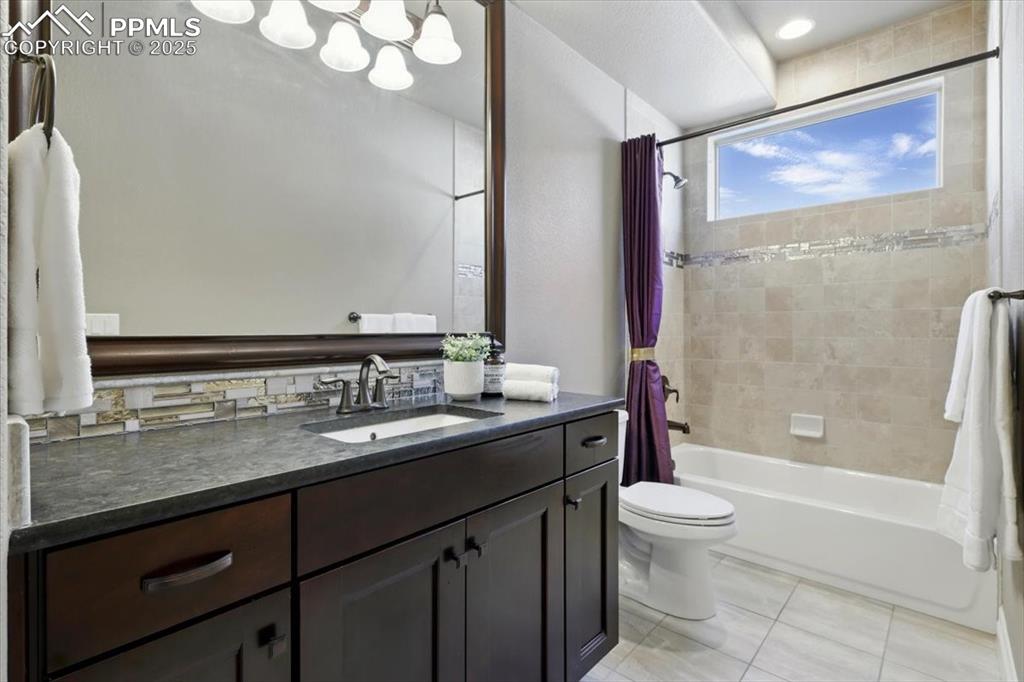 4577 Outlook Ridge Trail Colorado Springs, CO 80924 - Photo 15 of 45 a bathroom with a granite countertop sink toilet and shower
