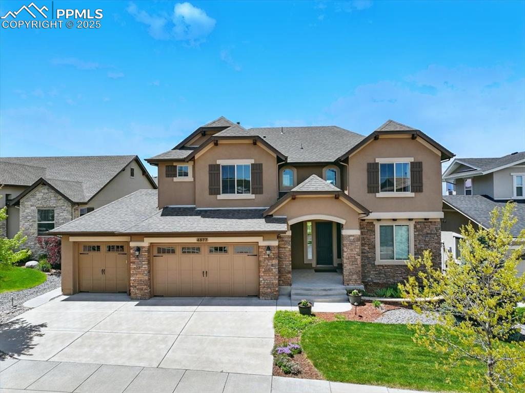 4577 Outlook Ridge Trail Colorado Springs, CO 80924 - Photo 2 of 45 a front view of a house with a yard