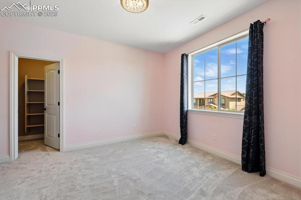 4577 Outlook Ridge Trail Colorado Springs, CO 80924 - Photo 26 of 45 an empty room with windows