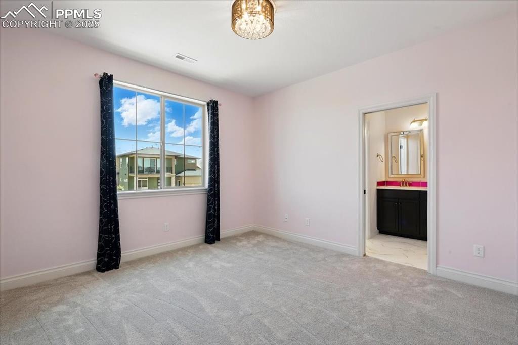 4577 Outlook Ridge Trail Colorado Springs, CO 80924 - Photo 28 of 45 an empty room with windows