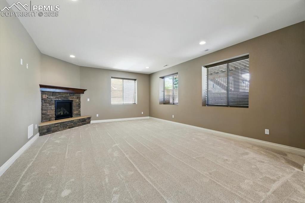 4577 Outlook Ridge Trail Colorado Springs, CO 80924 - Photo 33 of 45 a view of an empty room with window and fire place