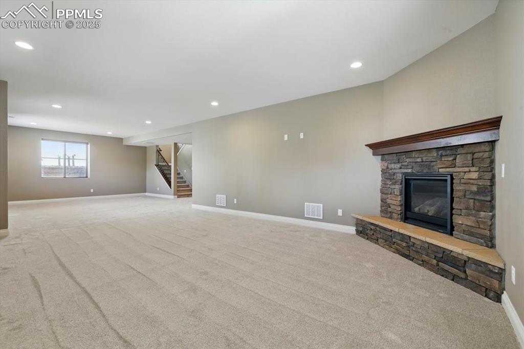 4577 Outlook Ridge Trail Colorado Springs, CO 80924 - Photo 35 of 45 a view of empty room with window and fireplace