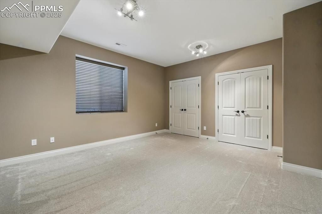 4577 Outlook Ridge Trail Colorado Springs, CO 80924 - Photo 38 of 45 a view of an empty room with a window