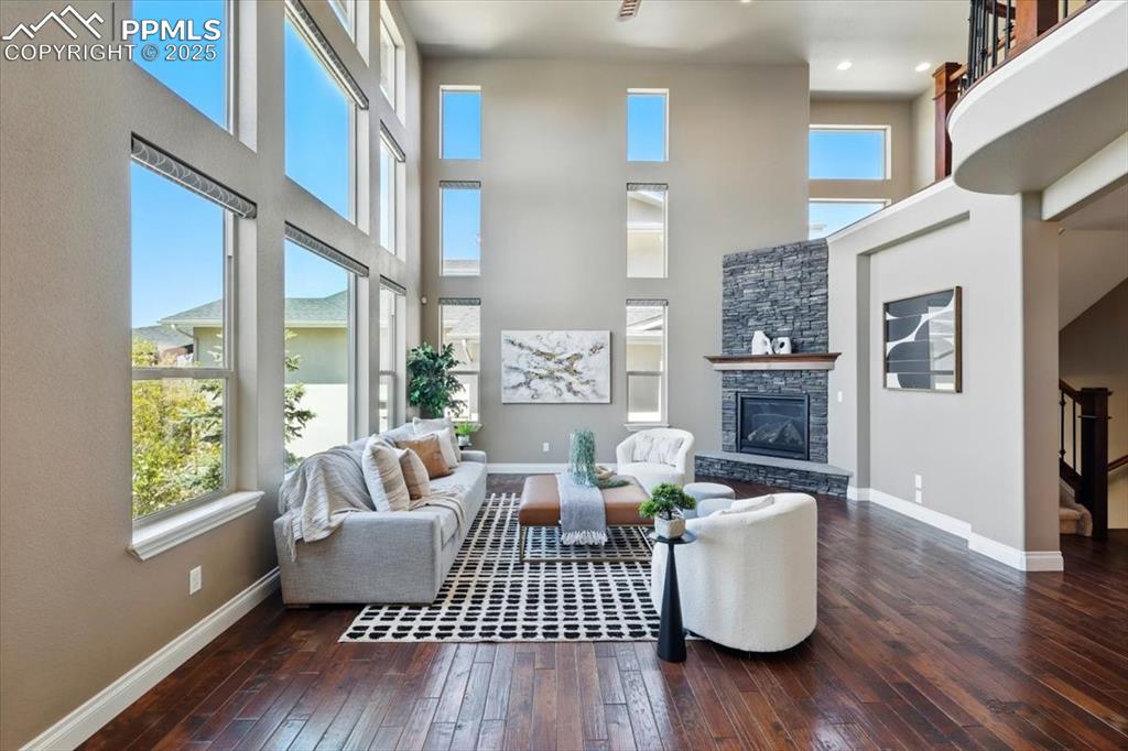 4577 Outlook Ridge Trail Colorado Springs, CO 80924 - Photo 9 of 45 a living room with furniture wooden floor and a large window