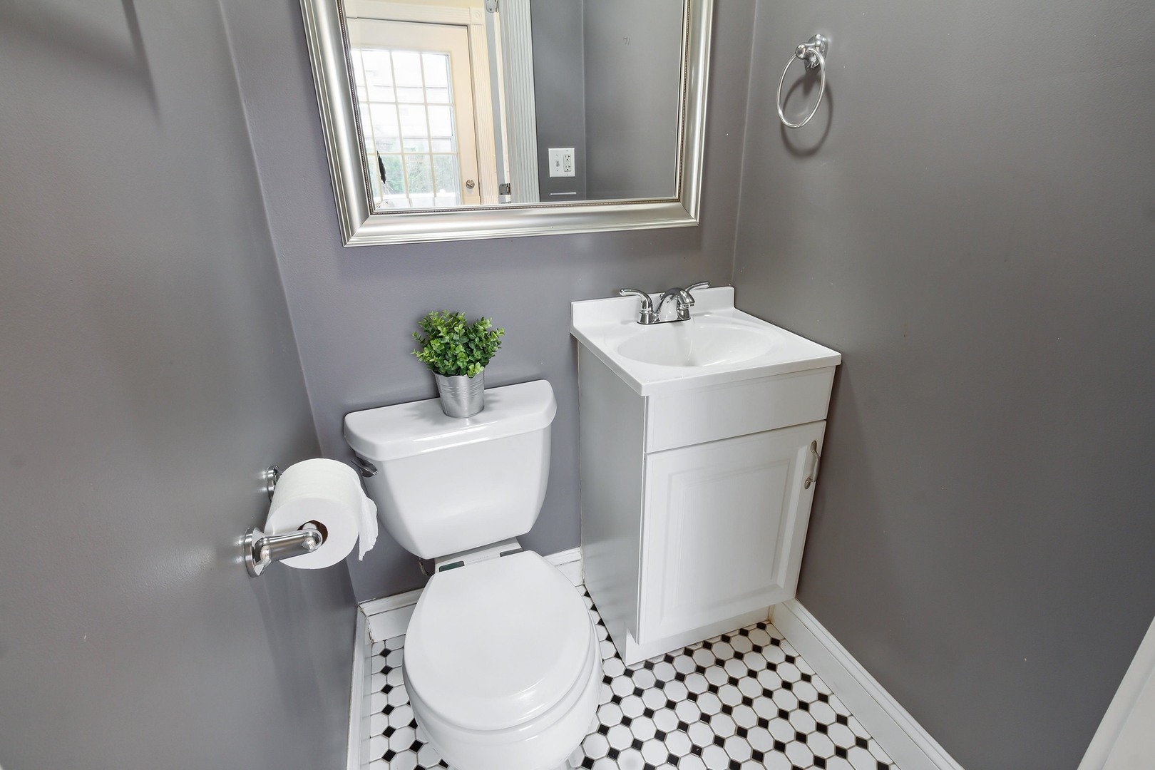 9430 Jackson Avenue Brookfield, IL 60513 - Photo 8 of 17 a white toilet sitting next to a bathroom sink