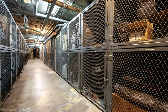 a view of kitchen with stainless steel appliances cabinets and a wooden floor