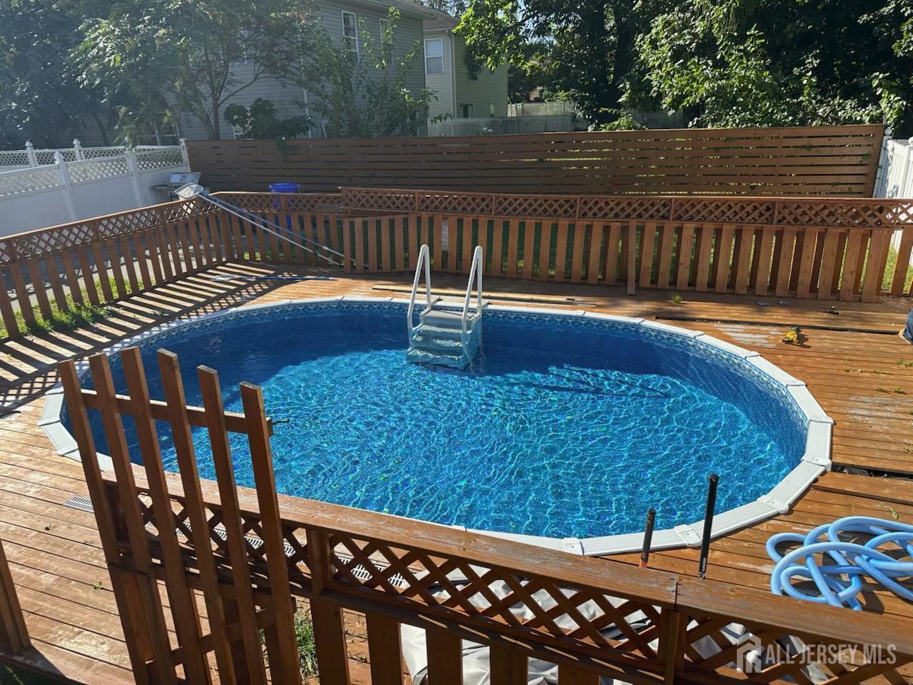 229 Monroe Street Rahway, NJ 07065 - Photo 15 of 15 a view of a roof deck with wooden floor