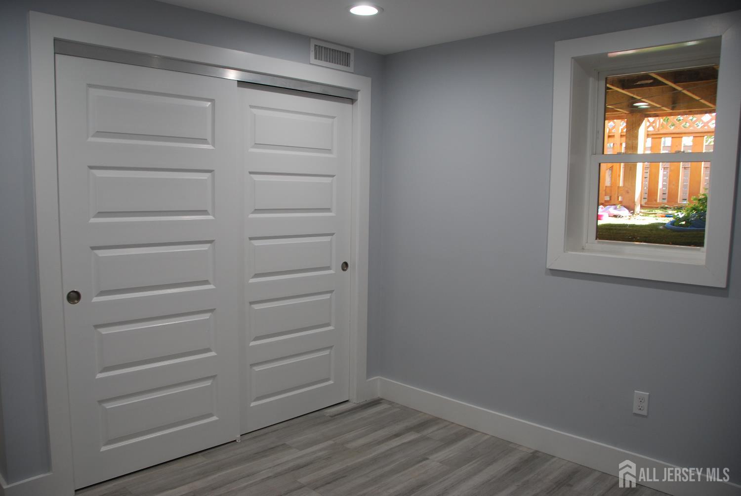 229 Monroe Street Rahway, NJ 07065 - Photo 10 of 15 a view of walk in closet with empty racks