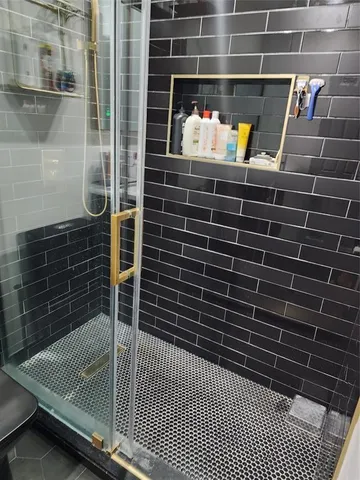 a bathroom with a sink and a shower