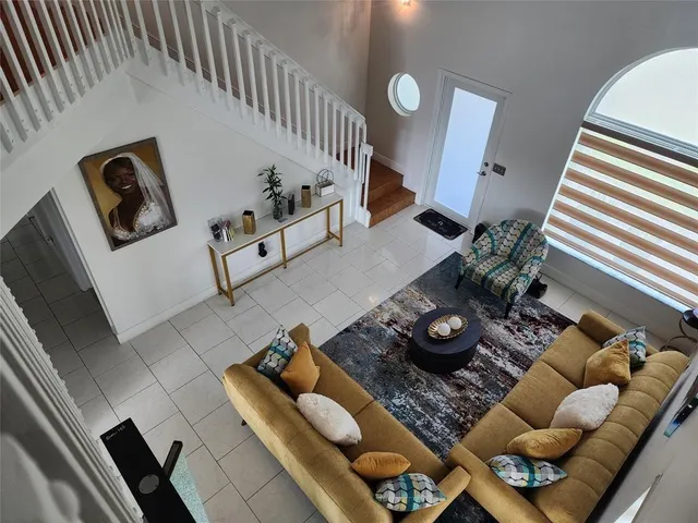 a living room with furniture and a rug