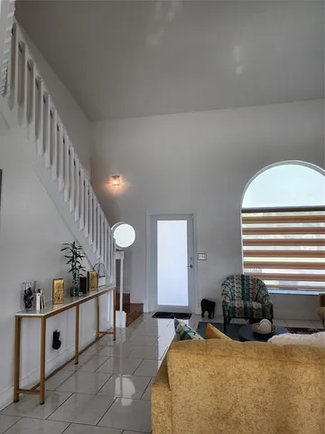 a bed room with furniture and stairs