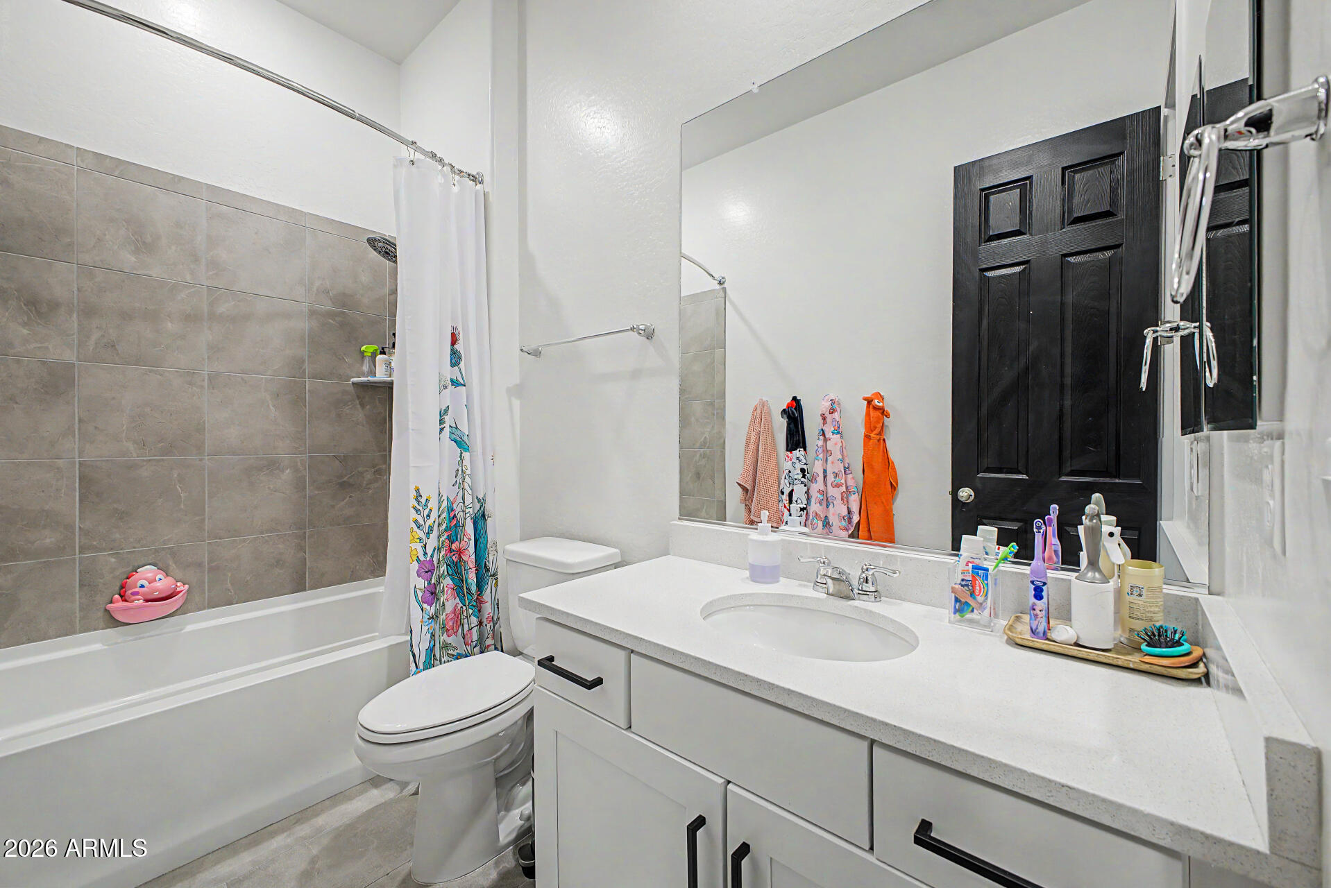 6511 West Steed Ridge Phoenix, AZ 85083 - Photo 27 of 41 a bathroom with a sink vanity mirror bathtub shower and toilet