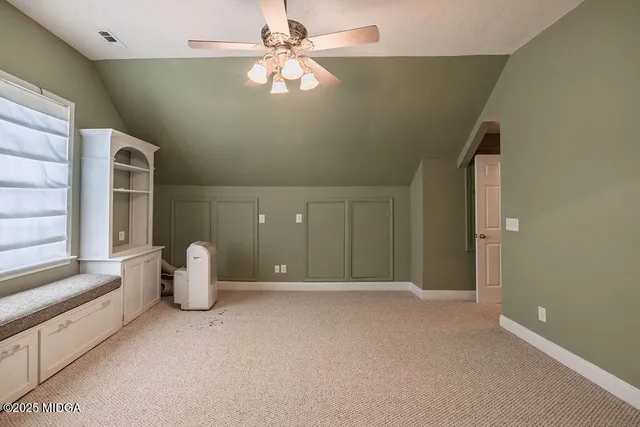 a view of a livingroom with a staircase