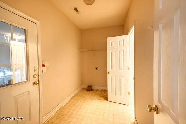 a view of a bathroom with a tub and shower