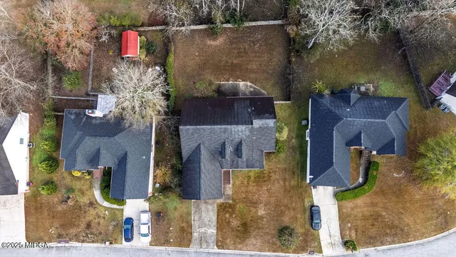 an aerial view of houses with outdoor space