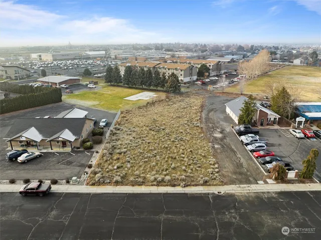 an aerial view of a city with big lake view