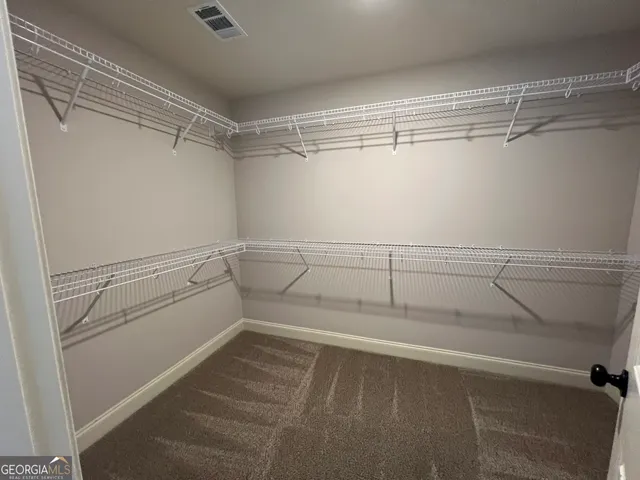 a view of an empty walk in closet
