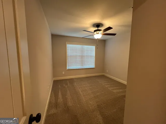 a view of empty room with windows