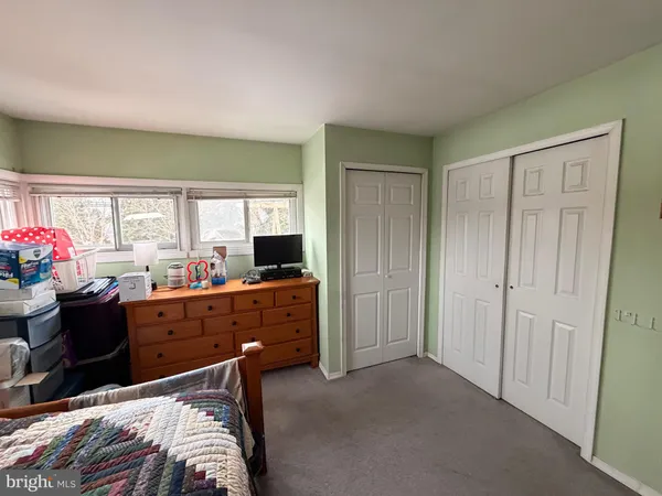 a room with furniture and a dresser