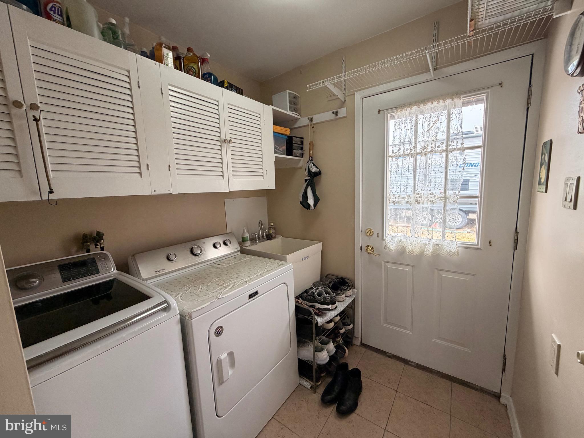 25 Balsam Road Levittown, PA 19057 - Photo 17 of 17 a utility room with dryer and washer