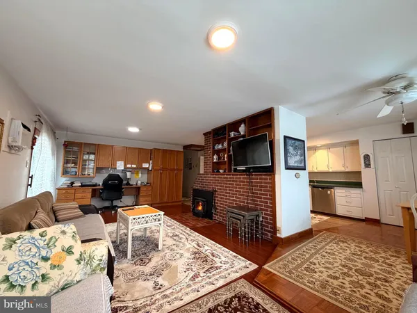a living room with furniture and a rug
