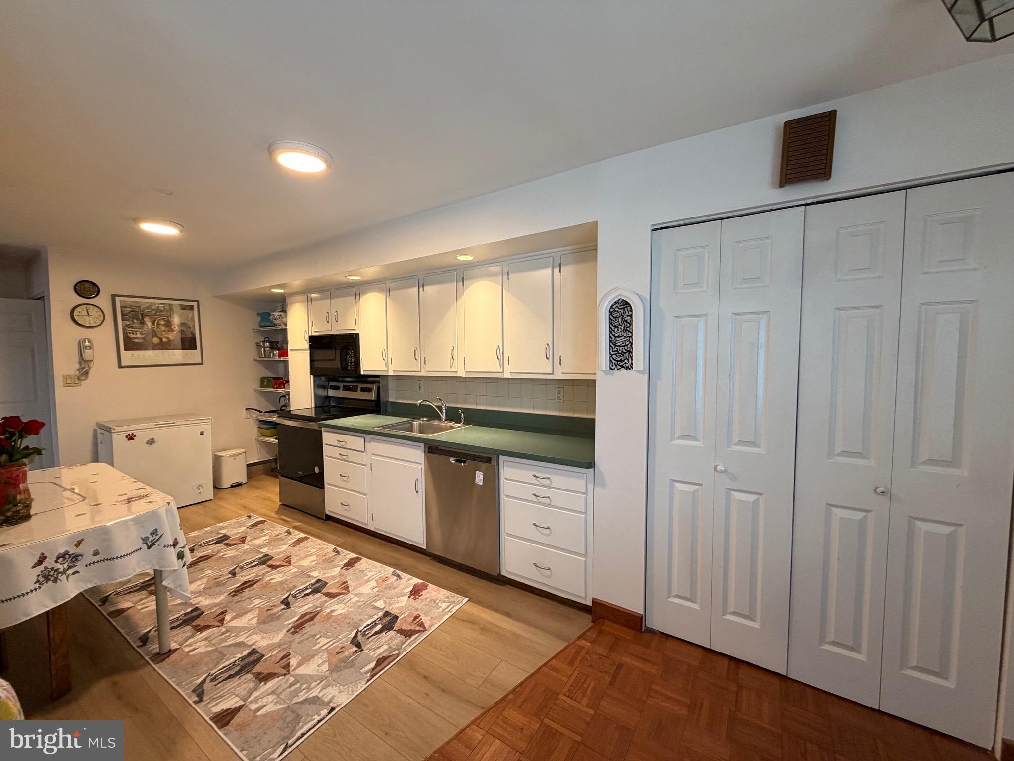 25 Balsam Road Levittown, PA 19057 - Photo 9 of 17 a kitchen with stainless steel appliances kitchen island granite countertop a refrigerator and stove top oven