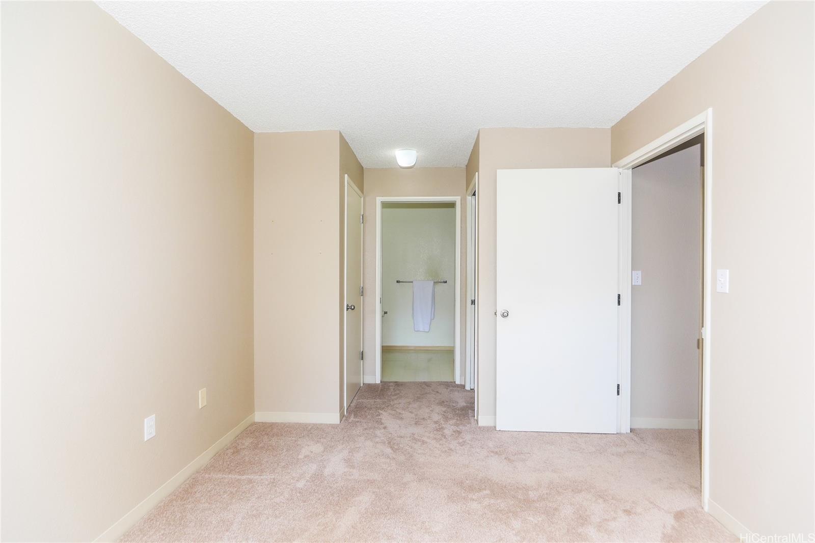 94-508 Kupuohi Street, Unit 8103 Waipahu, HI 96797 - Photo 11 of 19 a view of an empty room with a bathroom