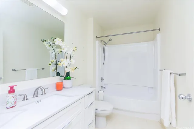 a bathroom with a sink a toilet and a bathtub