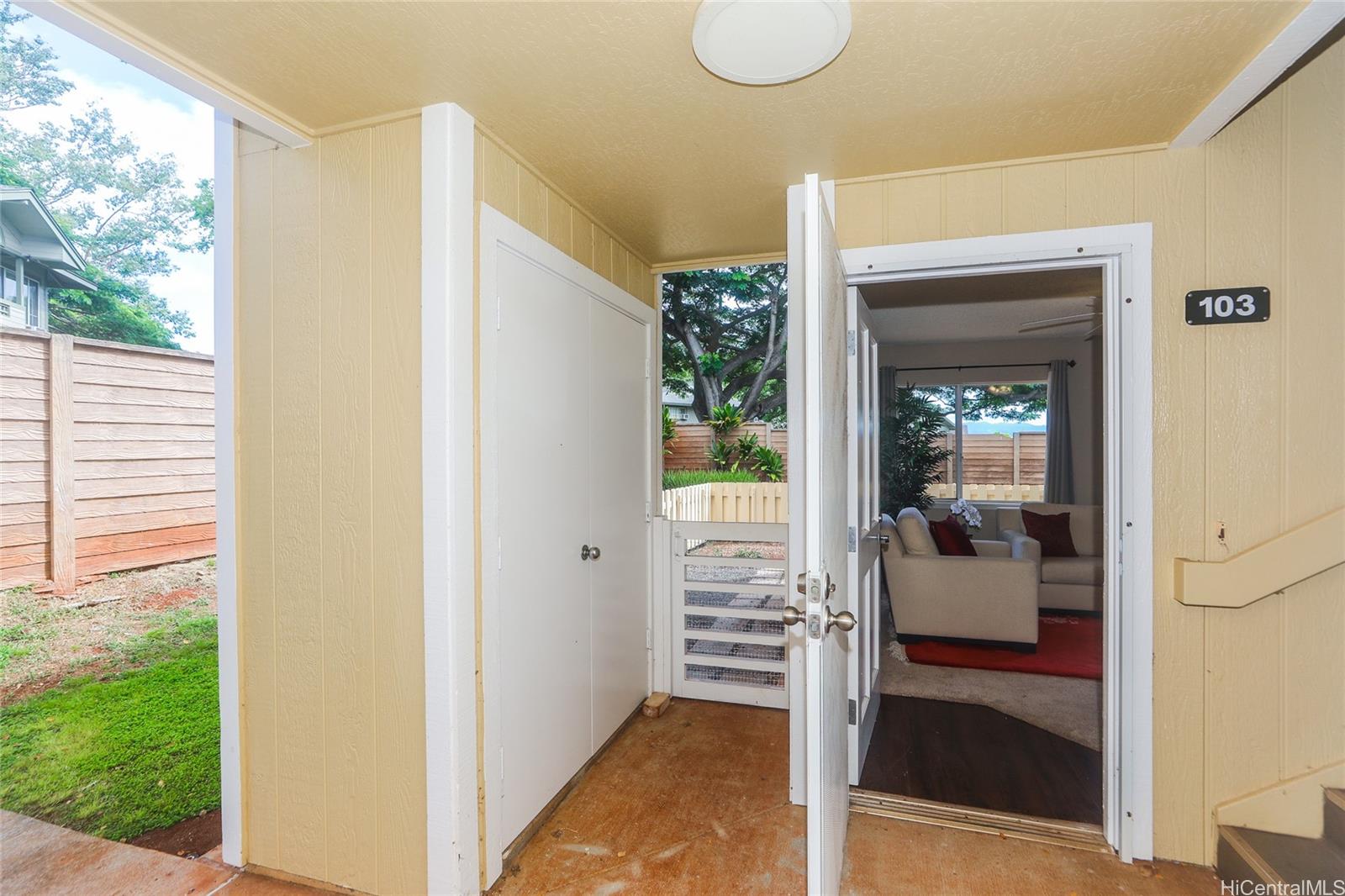 94-508 Kupuohi Street, Unit 8103 Waipahu, HI 96797 - Photo 2 of 19 a view of a porch with a table and chairs