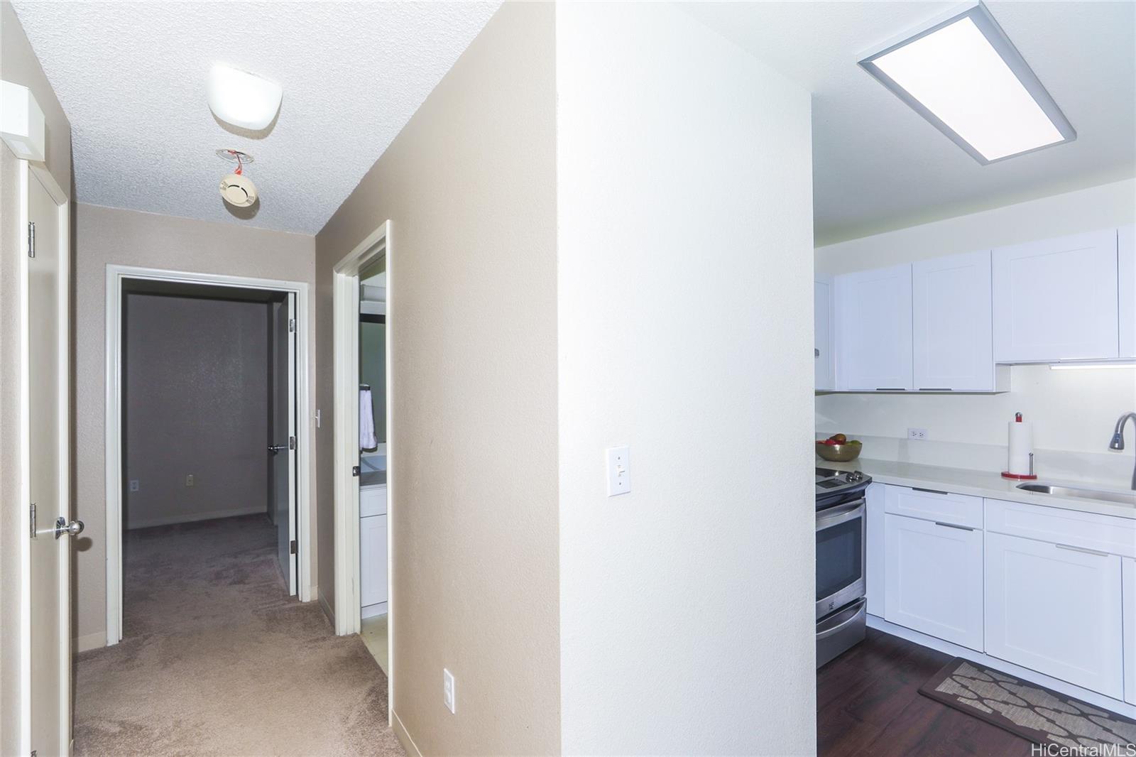 94-508 Kupuohi Street, Unit 8103 Waipahu, HI 96797 - Photo 8 of 19 a view of a kitchen with a sink