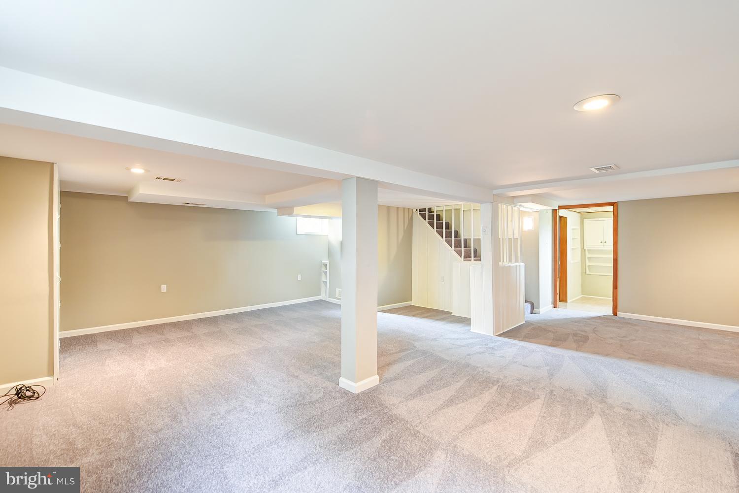 12816 Matey Road Silver Spring, MD 20906 - Photo 17 of 30 a view of an empty room with window and kitchen view
